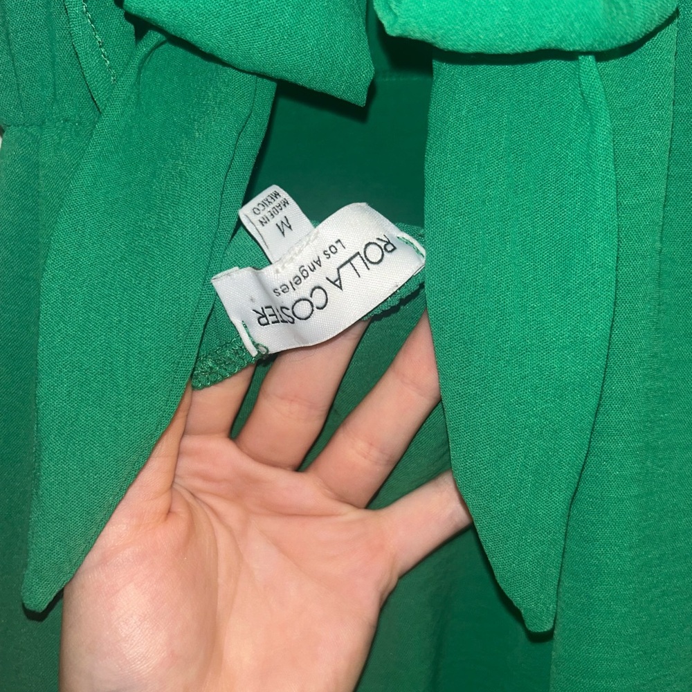 Green jumpsuit romper with scalloped shoulder straps